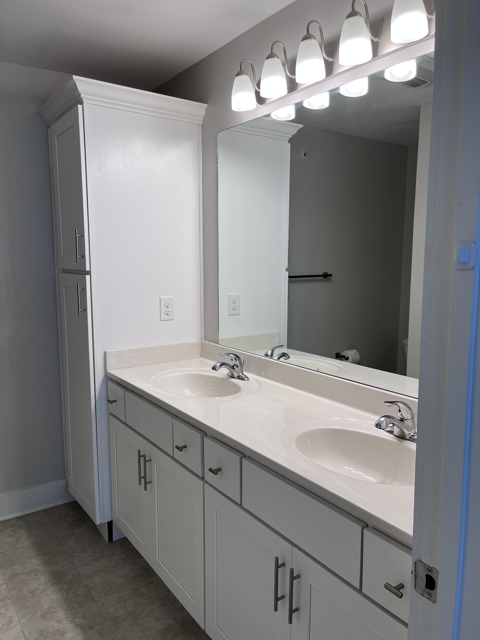 8011 Tuberose Court Spring Hill, TN 37174 - Photo 14 of 20 a bathroom with a sink a light fixture and a mirror