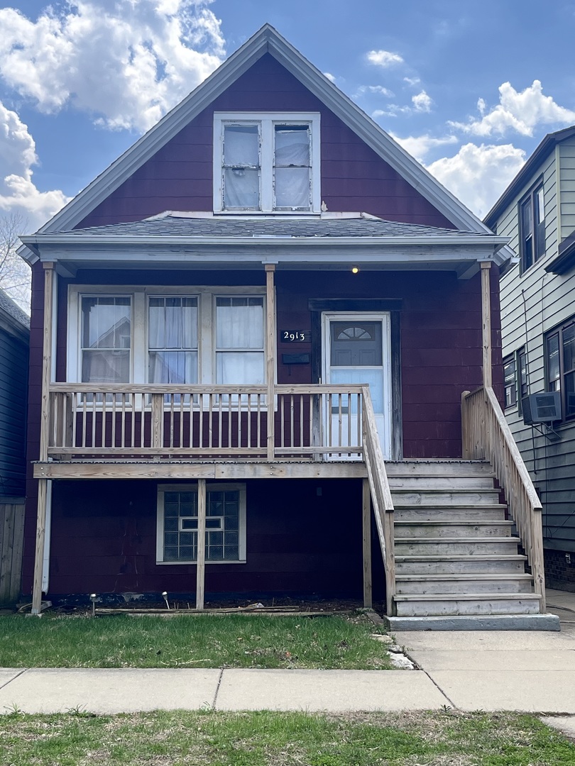 2913 East 97th Street Chicago, IL 60617 - Photo 1 of 16 a view of a brick house with lots of windows