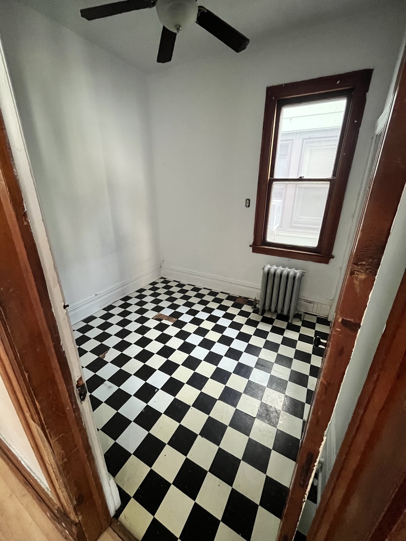 2913 East 97th Street Chicago, IL 60617 - Photo 11 of 16 a black and white checkered floor