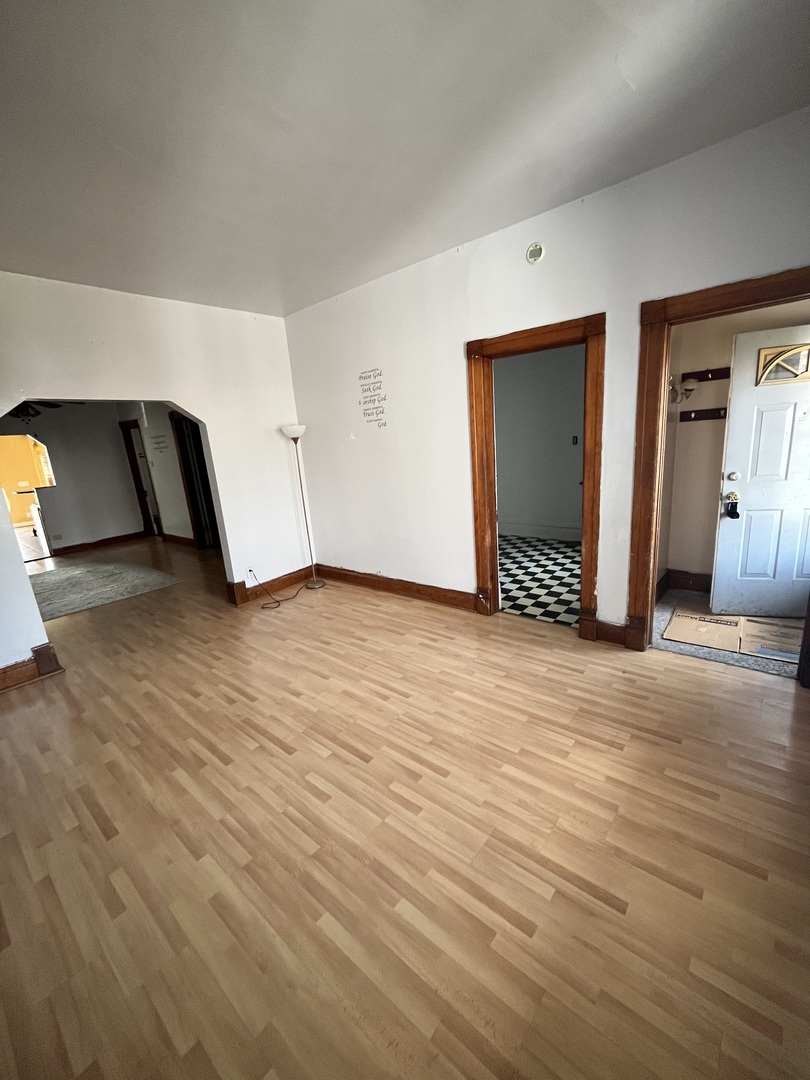 2913 East 97th Street Chicago, IL 60617 - Photo 3 of 16 a view of empty room with wooden floor