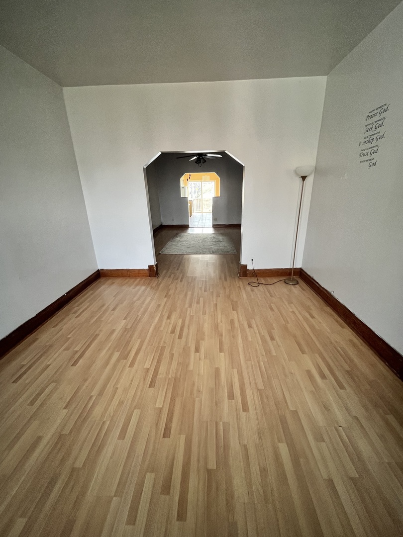 2913 East 97th Street Chicago, IL 60617 - Photo 10 of 16 a view of empty room with wooden floor