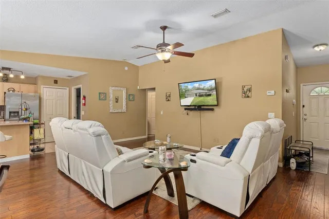a dining room with furniture and window