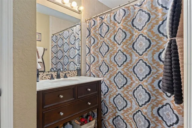 a view of backyard with outdoor seating and green space