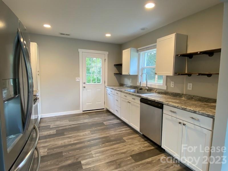 403 Ponderosa Road Stanley, NC 28164 - Photo 3 of 7 a large kitchen with stainless steel appliances granite countertop a refrigerator and a sink