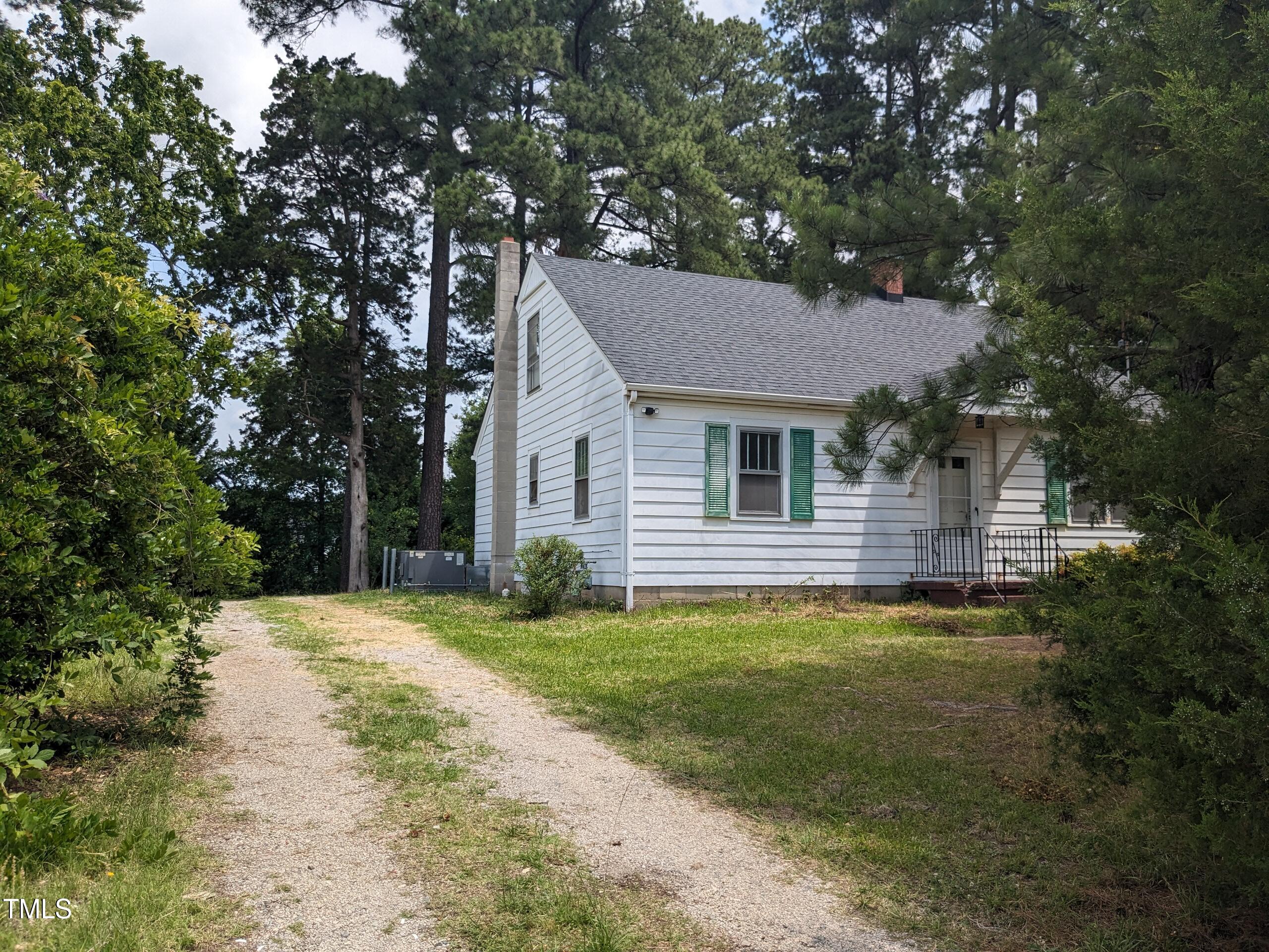 4503 Hopson Road Morrisville, NC 27560 - Photo 2 of 5 a front view of a house with a garden