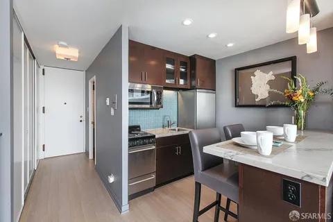 a living room with furniture fireplace and flat screen tv