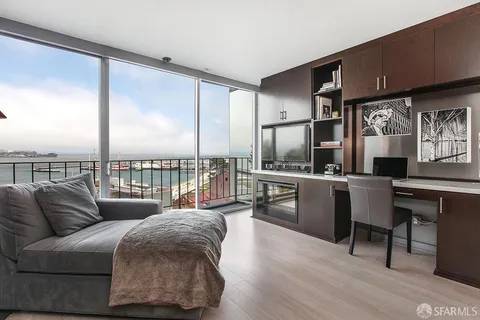 a open kitchen with a sink and refrigerator
