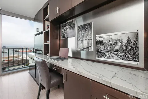 a kitchen with stainless steel appliances kitchen island granite countertop a refrigerator a stove and a sink