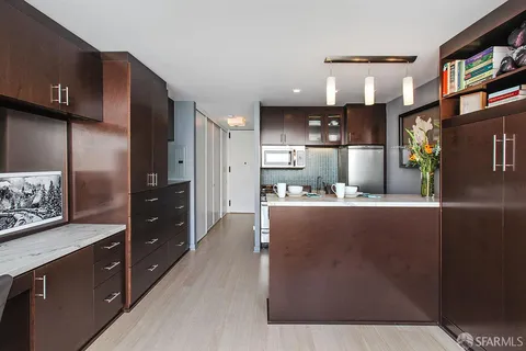 a bedroom with furniture and a book shelf