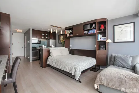 a large kitchen with stainless steel appliances granite countertop a large stove a sink dishwasher and cabinets