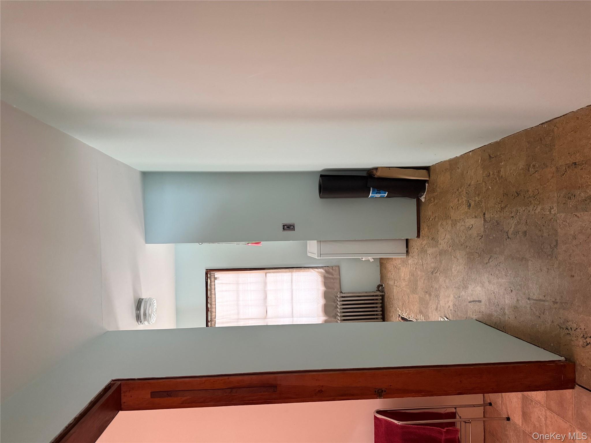 111 Mail Road Barryville, NY 12719 - Photo 18 of 34 Hallway featuring radiator and stone finish floors