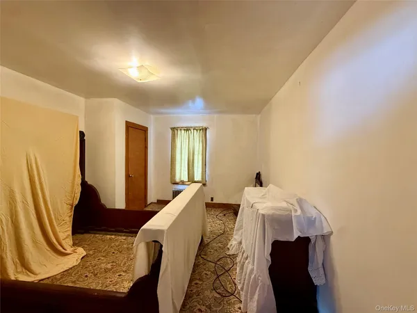 a view of a room with wooden floor and windows
