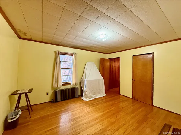 a bedroom with furniture and window