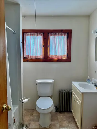 a view of mountain with sunset in background