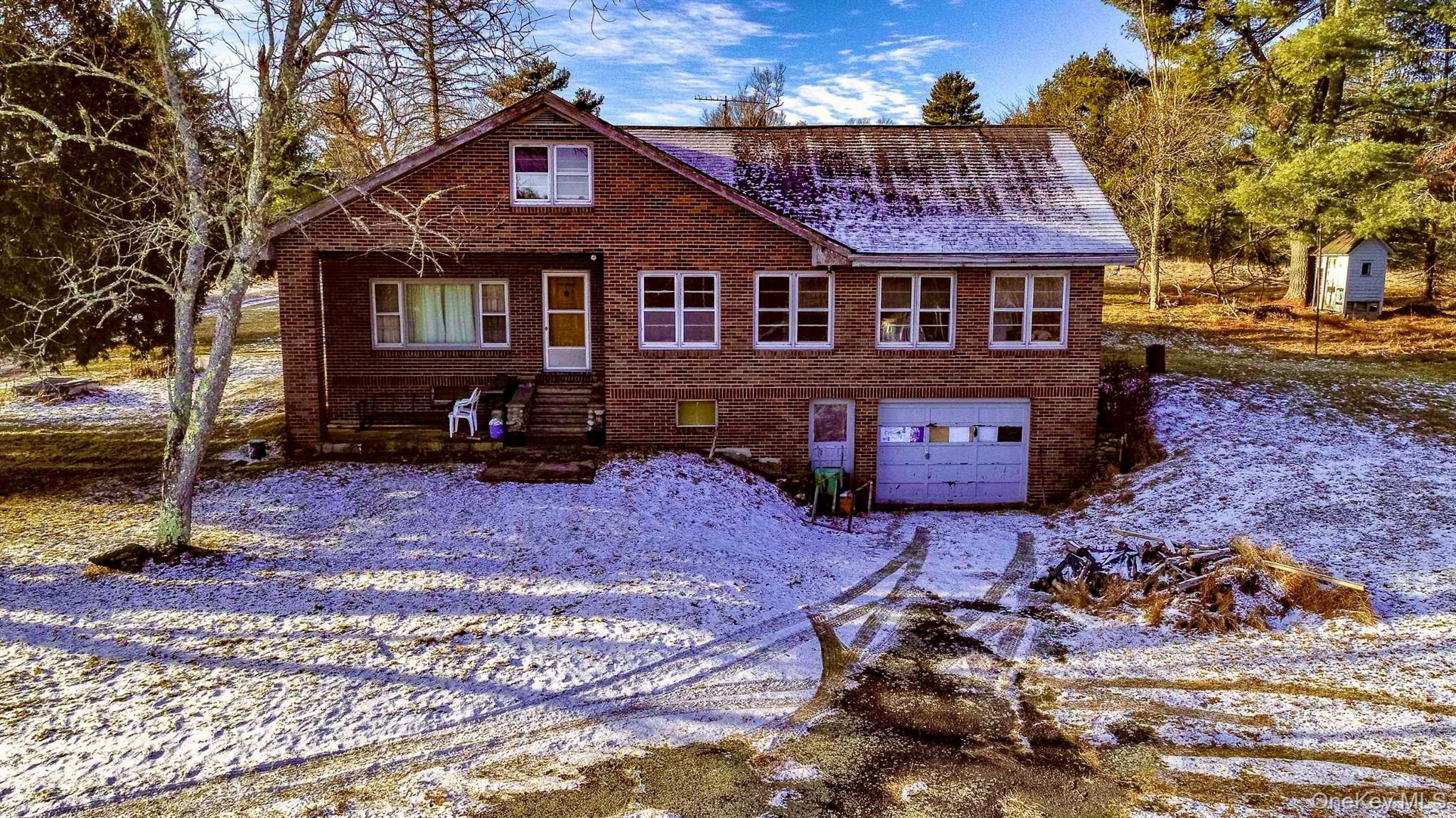 111 Mail Road Barryville, NY 12719 - Photo 3 of 34 View of front of property featuring brick siding and a garage