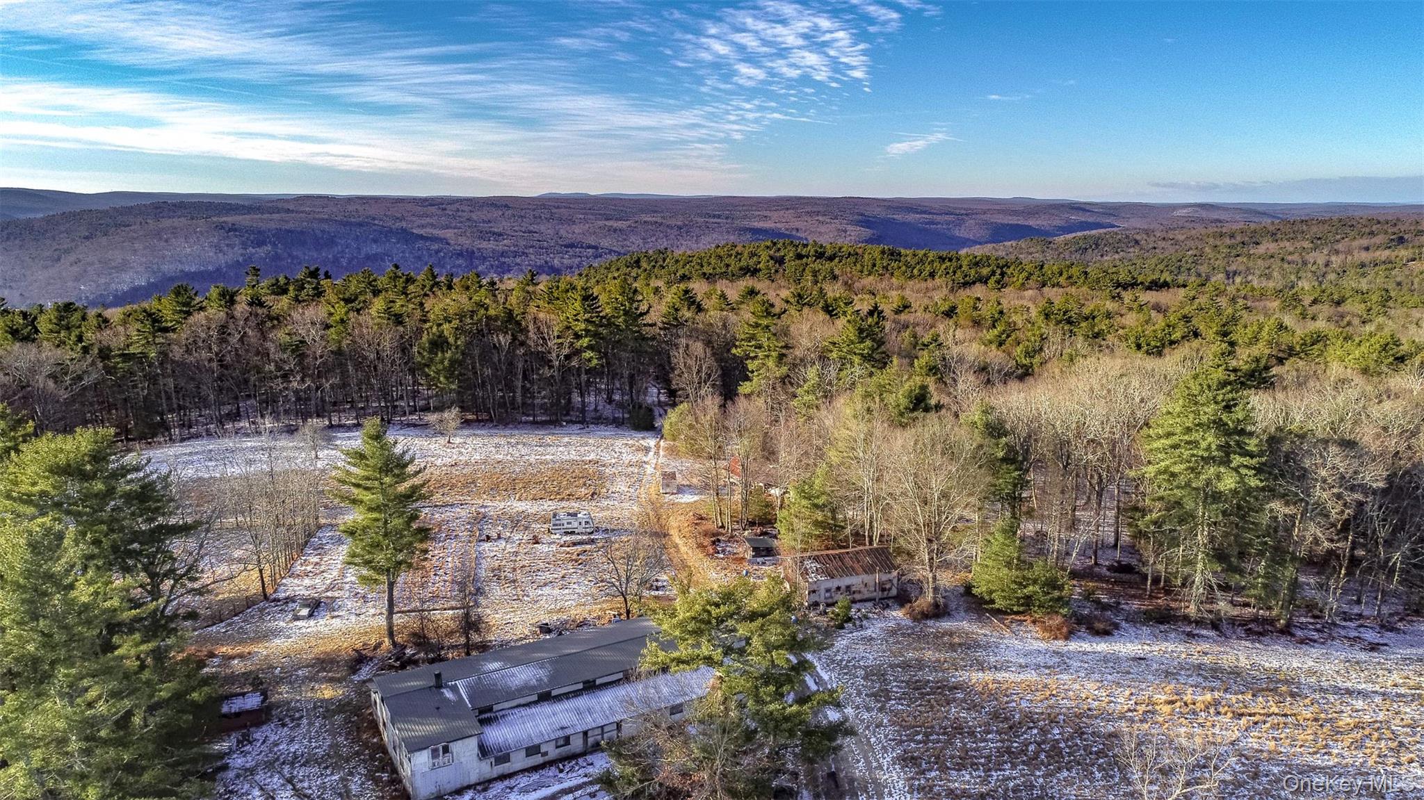 111 Mail Road Barryville, NY 12719 - Photo 31 of 34 Aerial view of a heavily wooded area and mountains