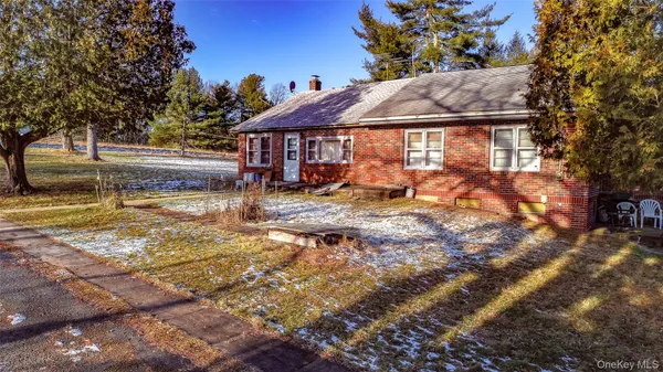 a view of a house with backyard porch and sitting area