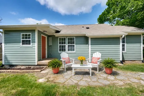 a view of house with outdoor sitting space