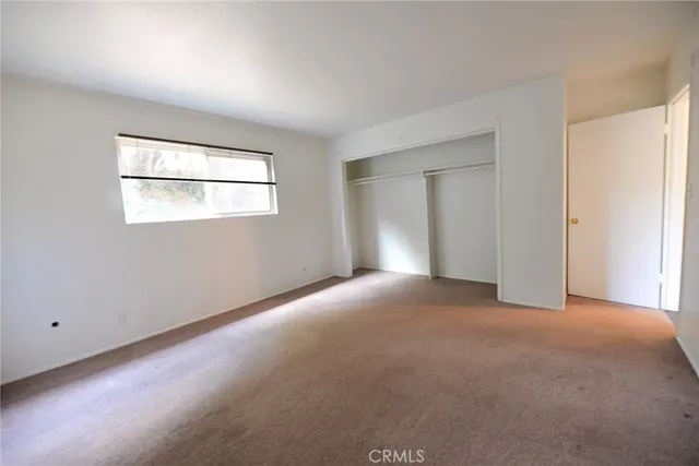 a view of a room that has a window in it