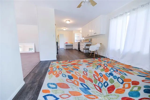 a bedroom with bed and window