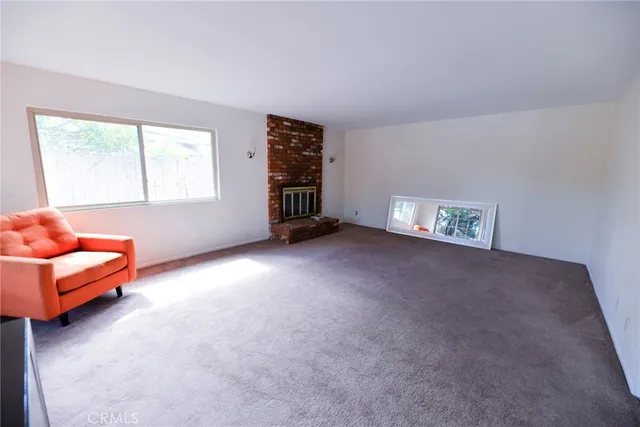 a view of livingroom with furniture and window