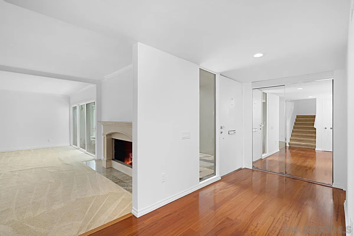 69 Half Moon Bend Coronado, CA 92118 - Photo 11 of 45 a view of a livingroom with wooden floor and staircase