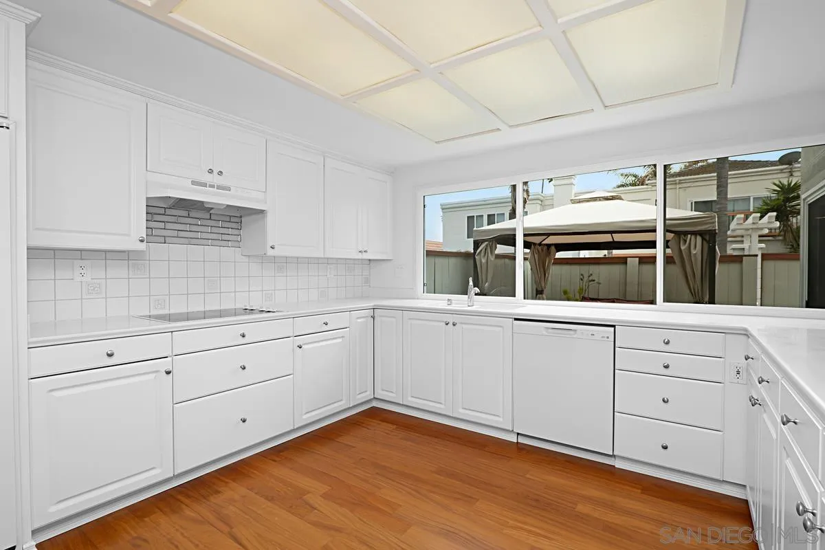 69 Half Moon Bend Coronado, CA 92118 - Photo 15 of 45 a kitchen with a cabinets and window