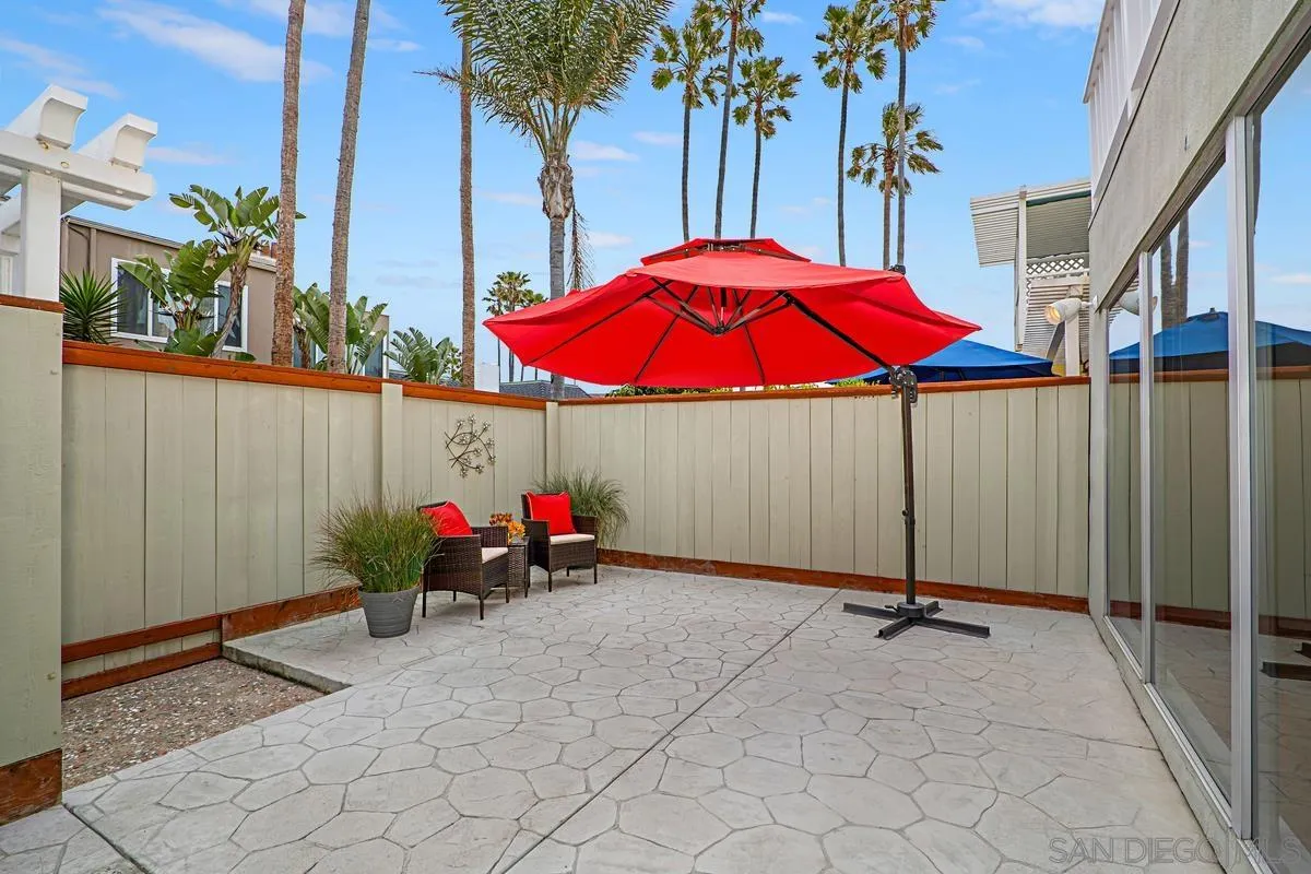 69 Half Moon Bend Coronado, CA 92118 - Photo 21 of 45 an outdoor space with furniture and umbrella