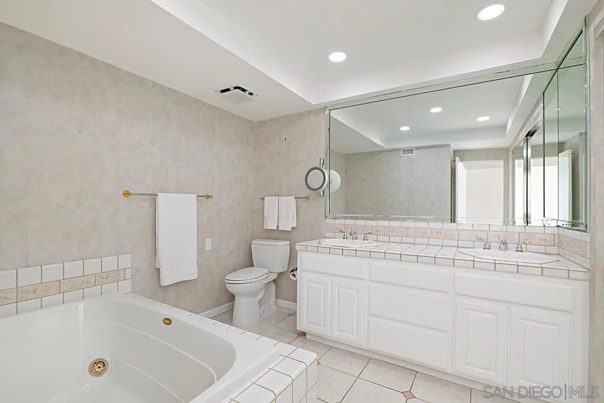 69 Half Moon Bend Coronado, CA 92118 - Photo 31 of 45 a bathroom with a sink a toilet and a bathtub