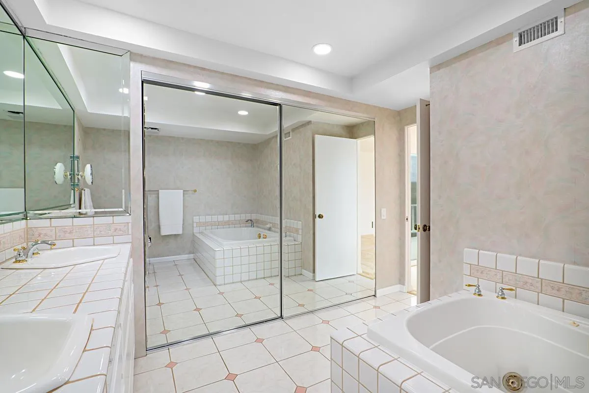 69 Half Moon Bend Coronado, CA 92118 - Photo 32 of 45 a bathroom with a tub sink and toilet