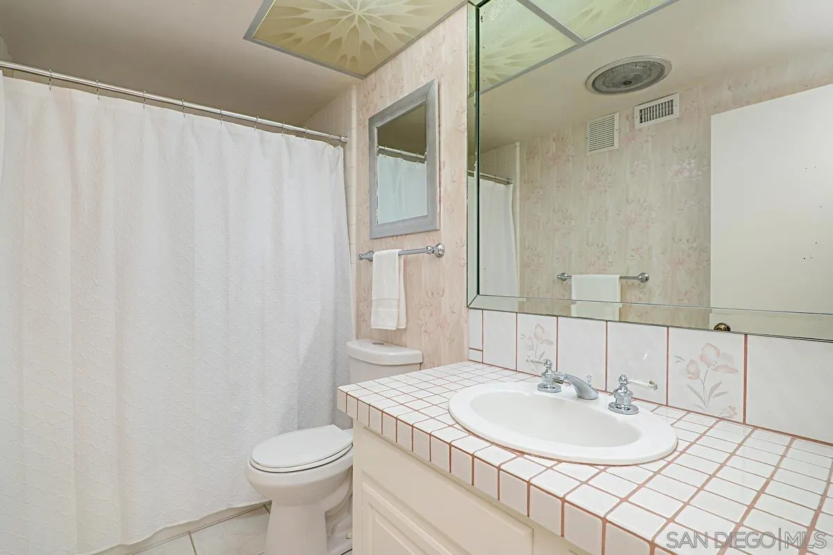 69 Half Moon Bend Coronado, CA 92118 - Photo 35 of 45 a bathroom with a sink and a mirror