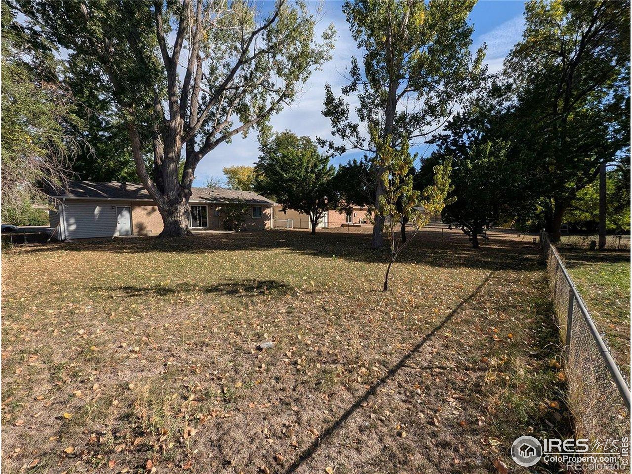 805 Gallup Road Fort Collins, CO 80521 - Photo 14 of 14 a view of a yard with wooden fence