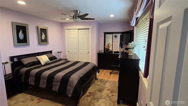 a bed room with a bed and a mirror