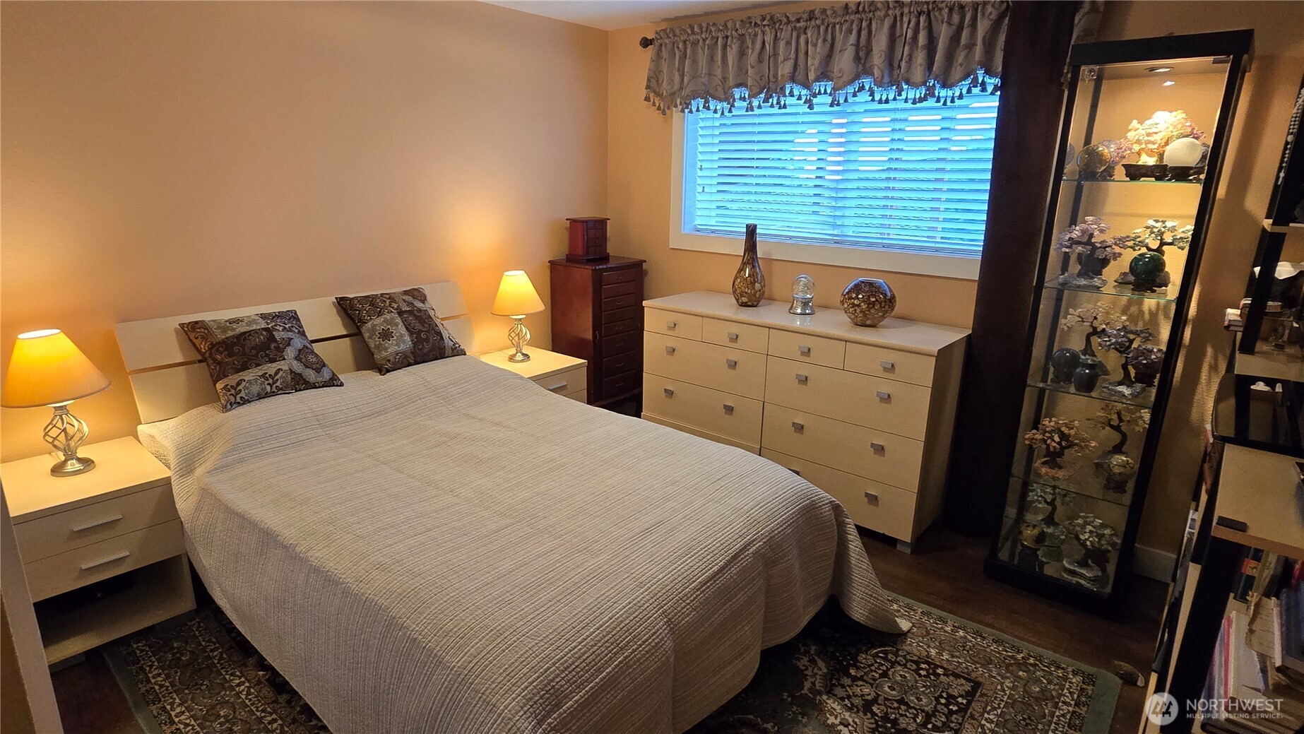 16342 72nd Avenue West Edmonds, WA 98026 - Photo 23 of 40 a large bed sitting in a bedroom next to a window