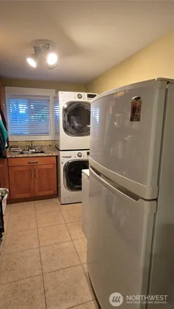 a kitchen with a refrigerator and a microwave