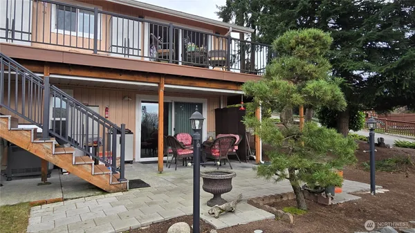 a view of a house with outdoor seating area