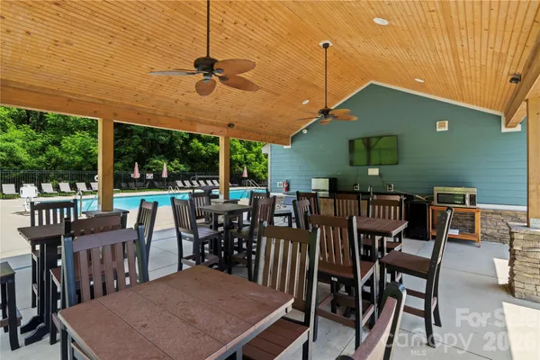 a view of a backyard with sitting area and furniture