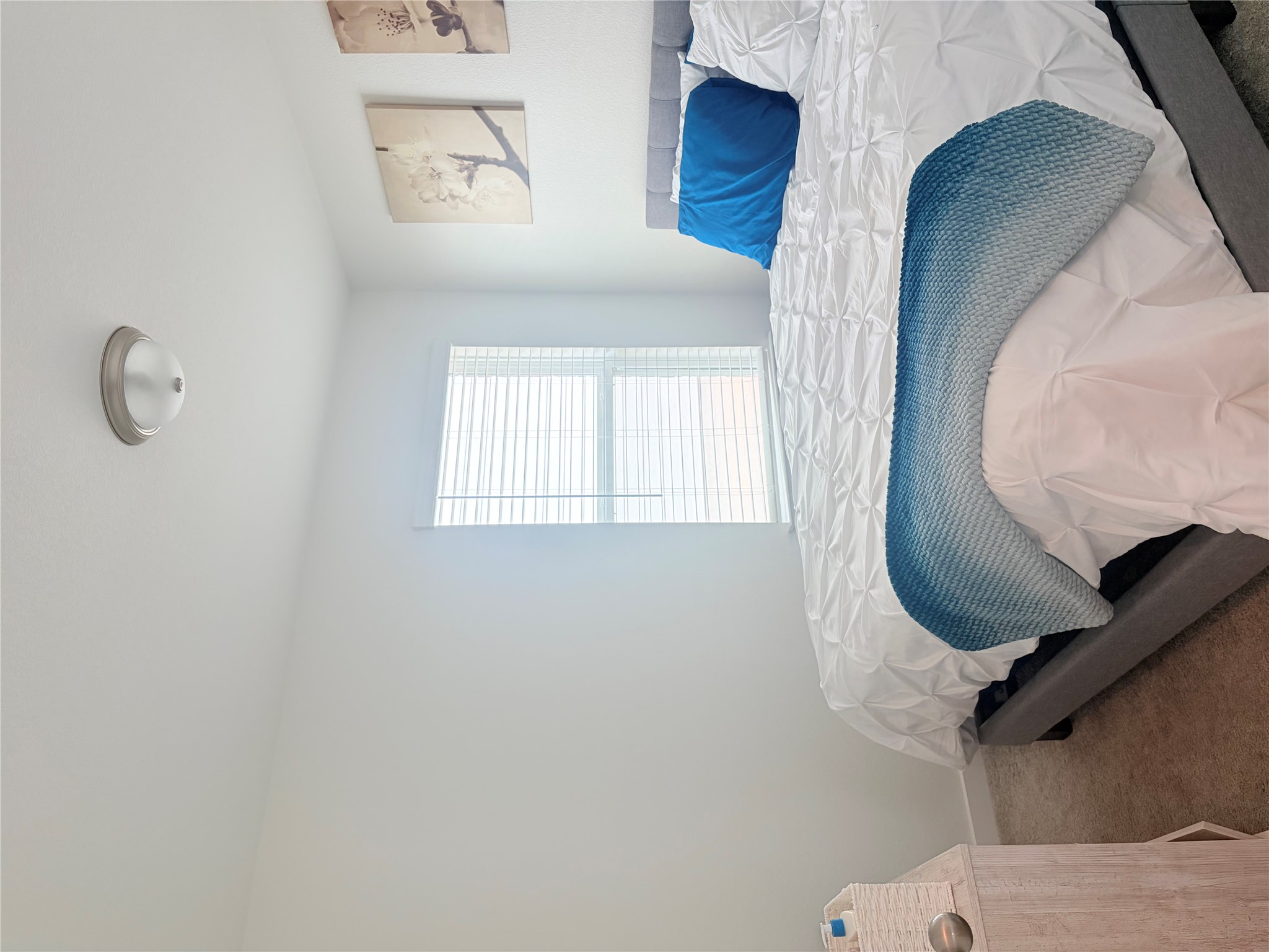 Carpeted bedroom featuring baseboards