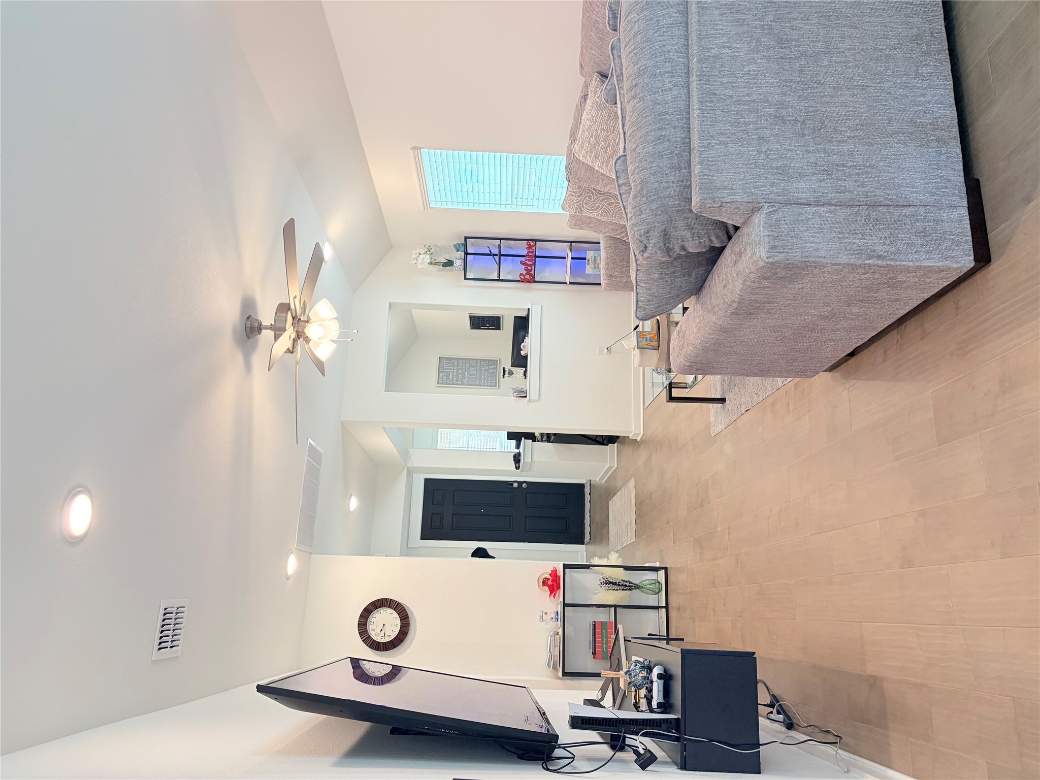 182 Shackleton Drive Kyle, TX 78640 - Photo 12 of 12 Living area with a ceiling fan, light wood-style flooring, vaulted ceiling, and recessed lighting