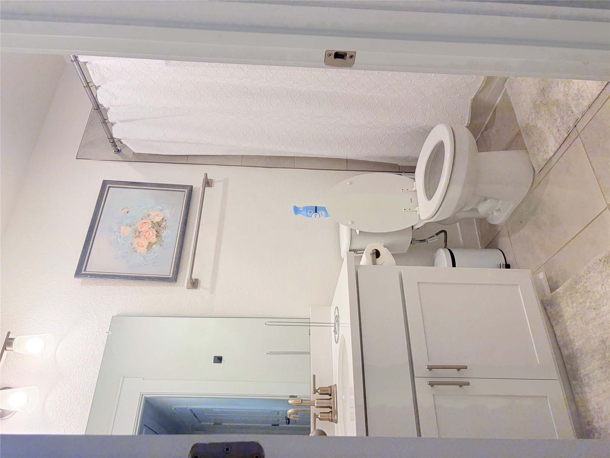 182 Shackleton Drive Kyle, TX 78640 - Photo 6 of 12 Bathroom featuring a shower with shower curtain, vanity, and light tile patterned floors