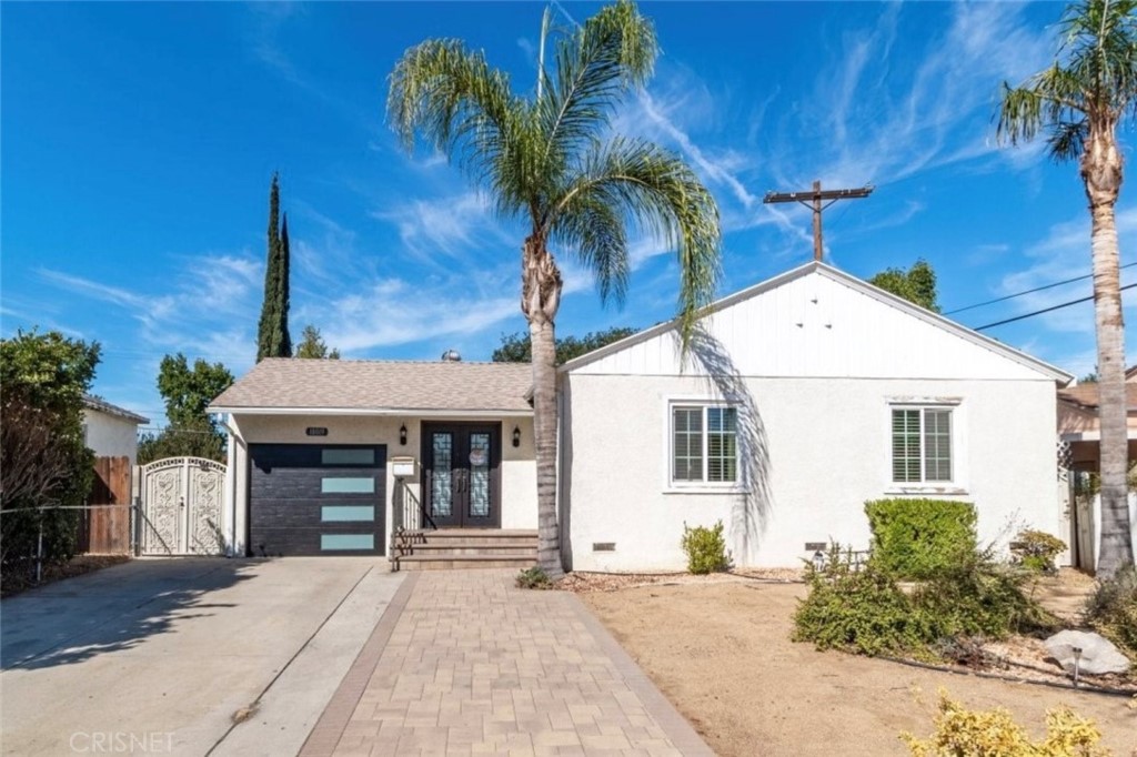 18019 Tiara Street Encino, CA 91316 - Photo 1 of 1 a front view of a house with a yard