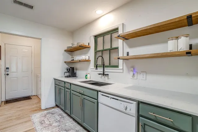 a kitchen with a sink and a cabinets