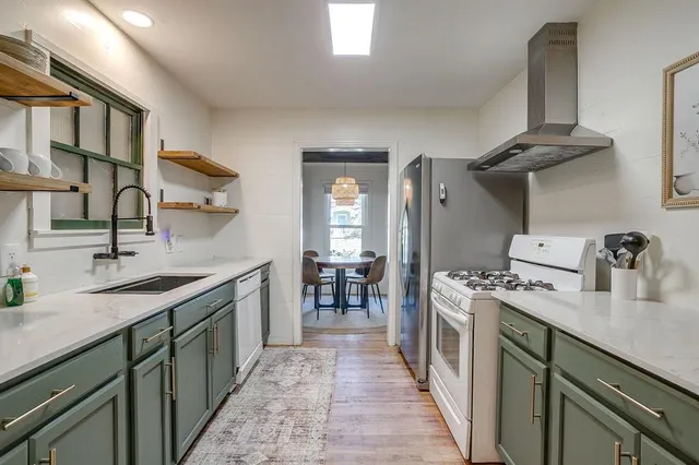 a kitchen with a sink and cabinets