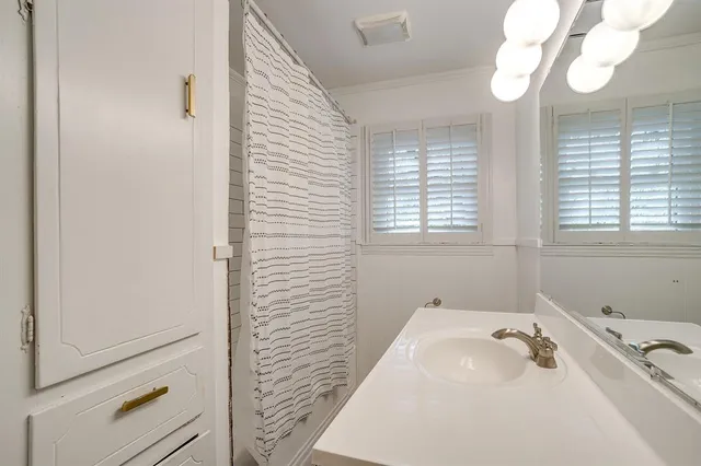 a bathroom with a sink and a bathtub