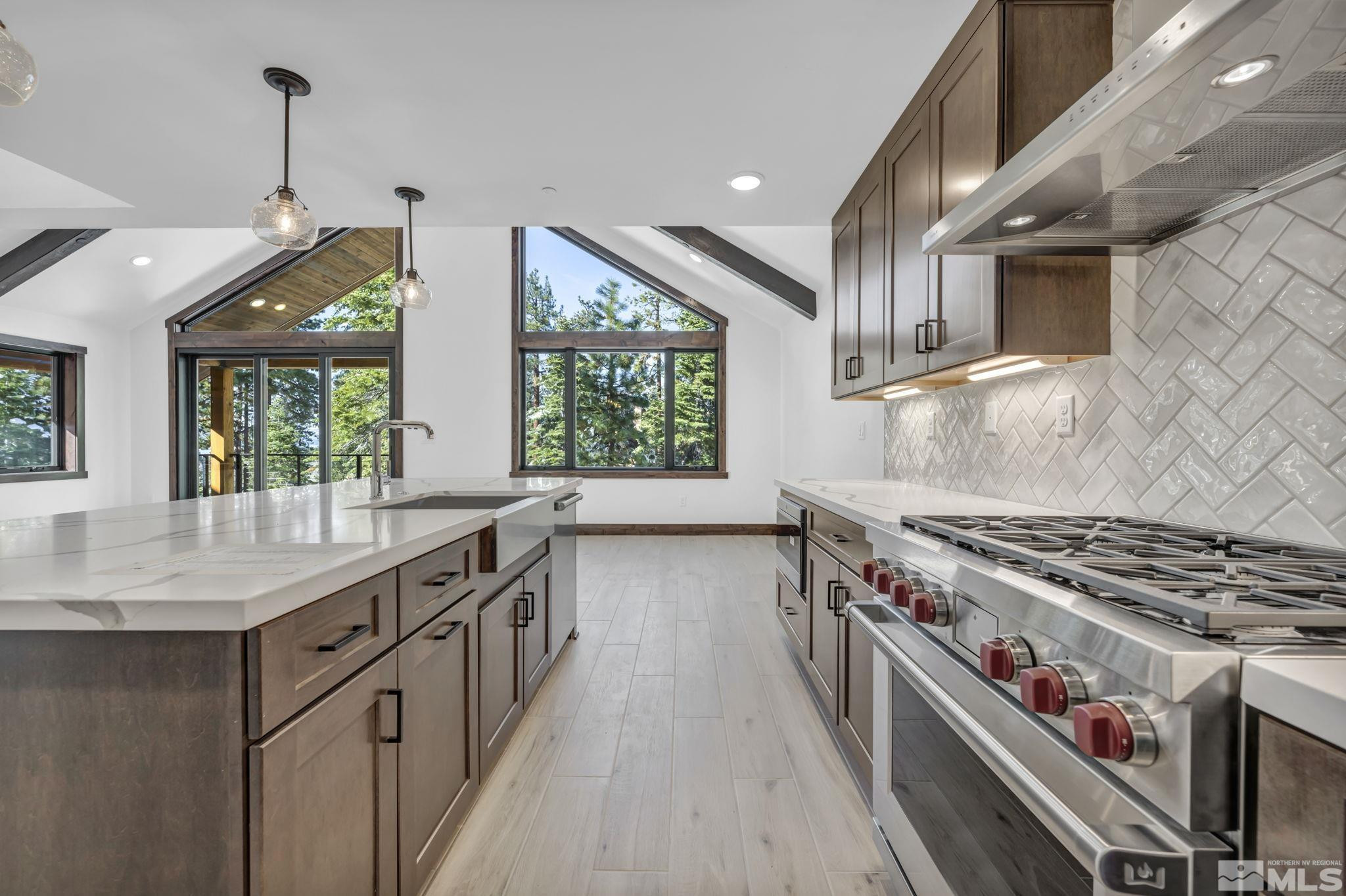 146 Sierra Colina Drive, Unit 34 Stateline, NV 89449 - Photo 11 of 38 a kitchen with stainless steel appliances granite countertop a stove and a sink