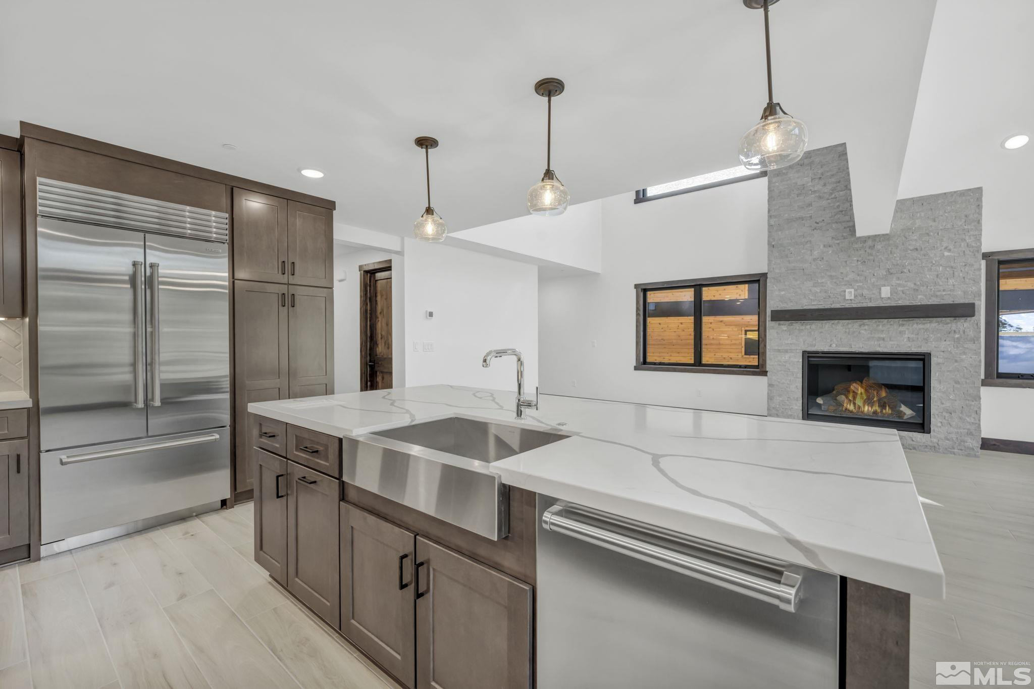 146 Sierra Colina Drive, Unit 34 Stateline, NV 89449 - Photo 13 of 38 a kitchen with a sink and a refrigerator