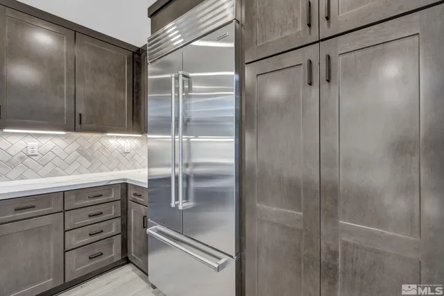 a bathroom with a shower and closet