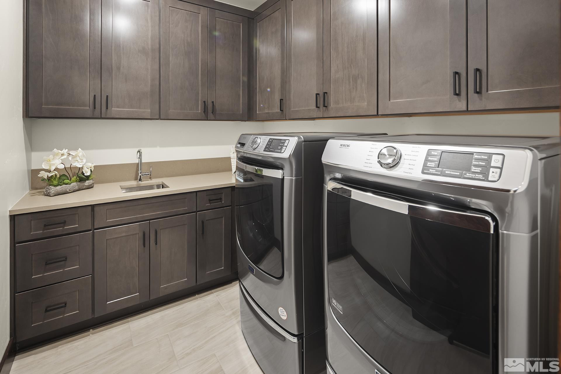 146 Sierra Colina Drive, Unit 34 Stateline, NV 89449 - Photo 19 of 38 a kitchen with stainless steel appliances granite countertop a sink a stove and a refrigerator with wooden cabinets
