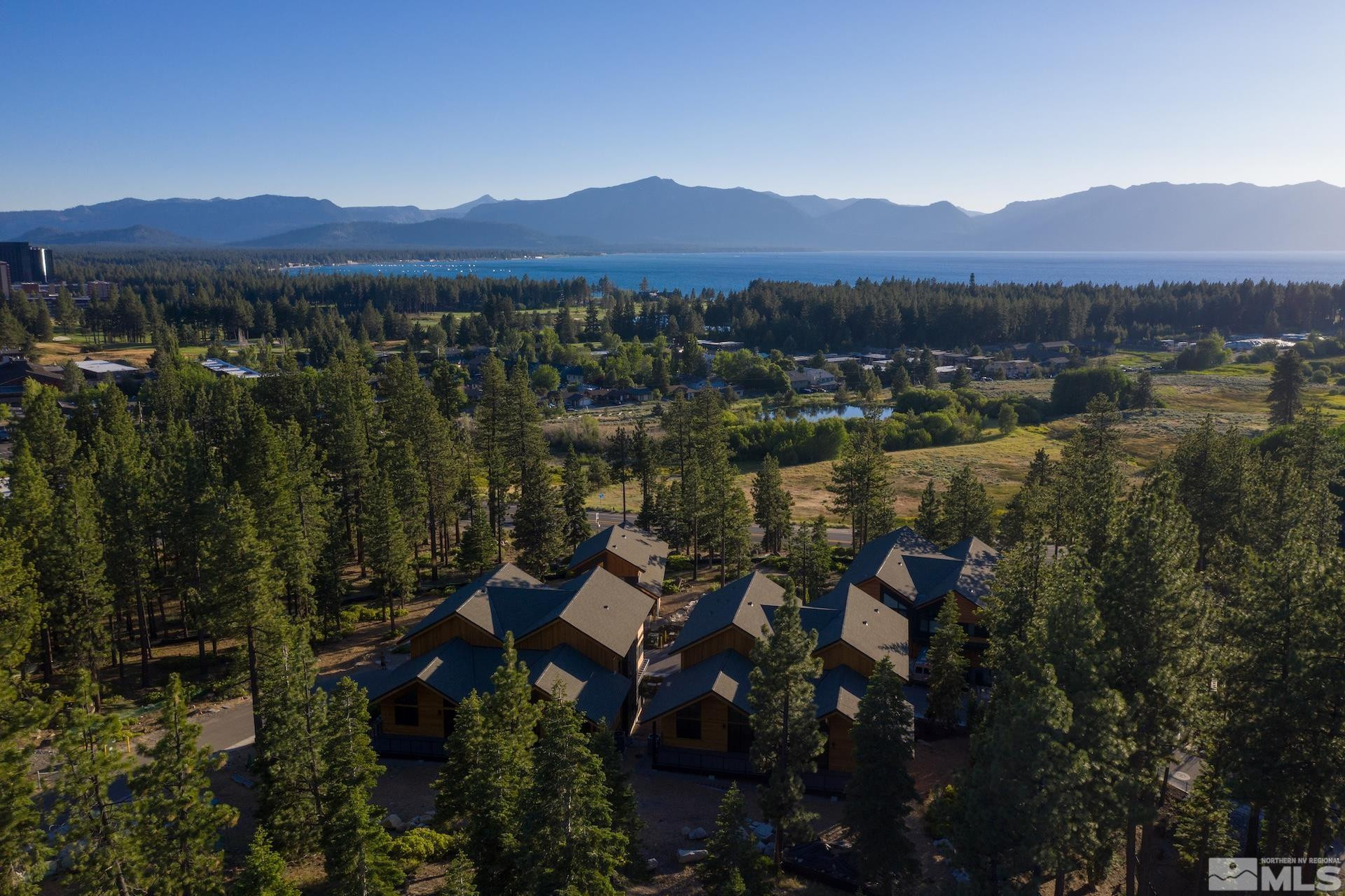 146 Sierra Colina Drive, Unit 34 Stateline, NV 89449 - Photo 2 of 38 a view of a lake with a mountain in the background