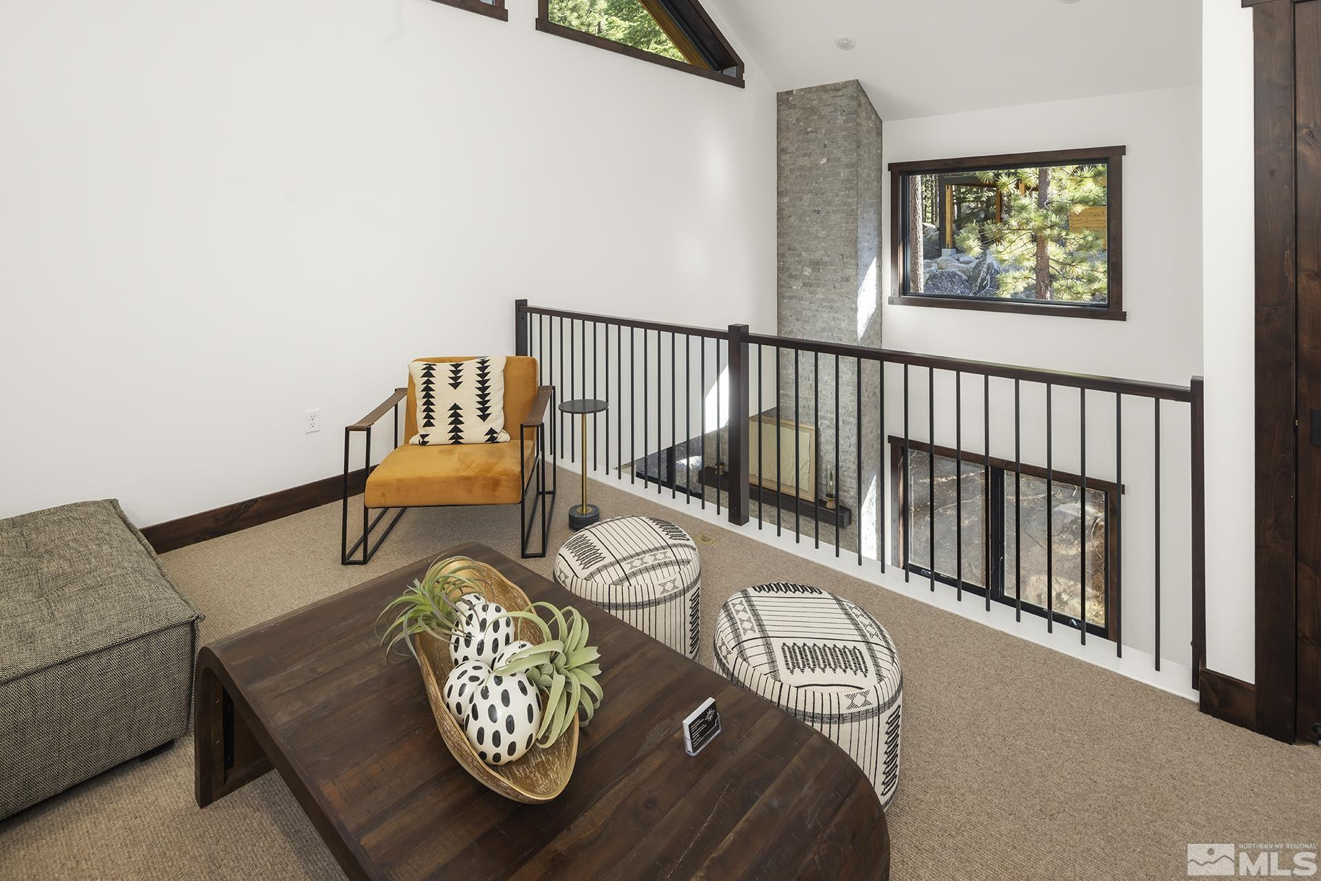 146 Sierra Colina Drive, Unit 34 Stateline, NV 89449 - Photo 22 of 38 a view of a hallway with couches and a dining table